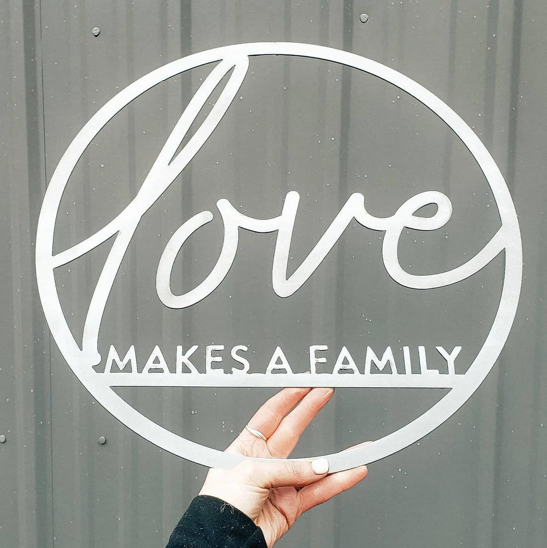 &quot;Love Makes a Family&quot; Circle Metal Wall Decor