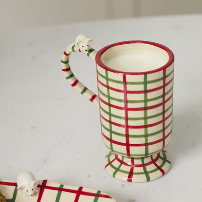 Plaid mug with a mouse handle on a white surface